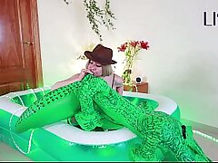 Lissa Brown, safari explorer, inflating an inflatable croc