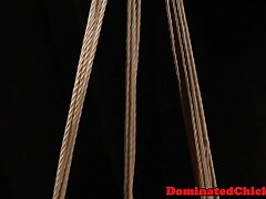 Busty restrained and whipped by dom